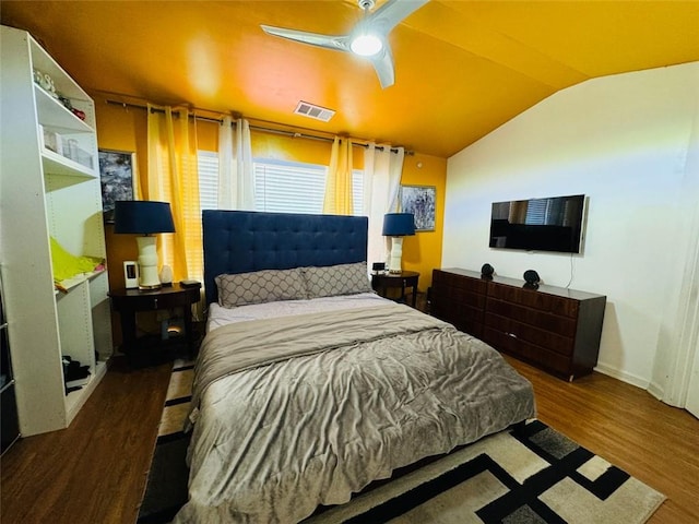 bedroom with vaulted ceiling, hardwood / wood-style floors, and ceiling fan