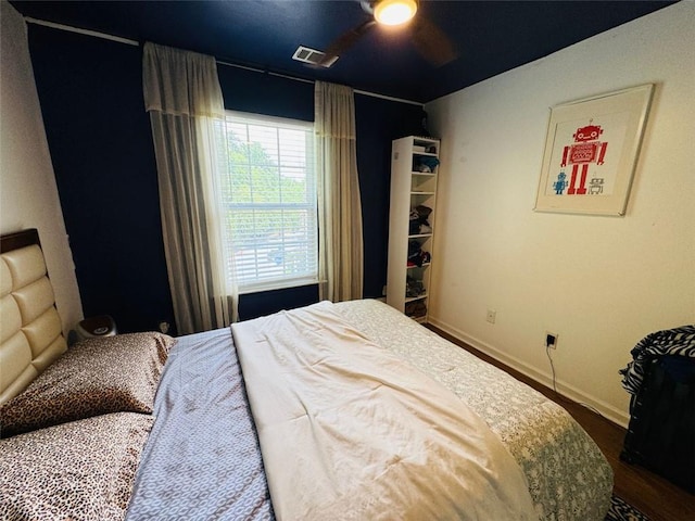 bedroom featuring ceiling fan and a closet