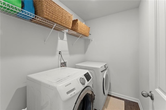 34 Hemlock Gln, Dallas, GA 30132 - washroom with washing machine and dryer, baseboards, and wood finished floors