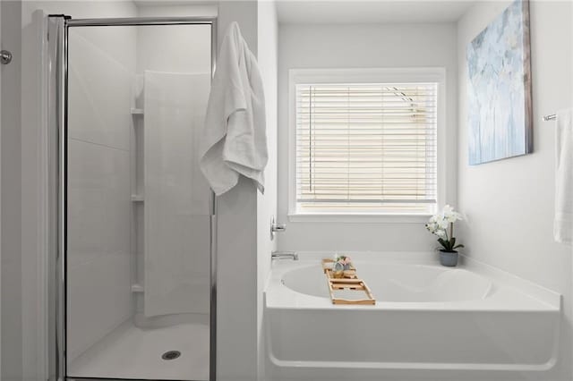 34 Hemlock Gln, Dallas, GA 30132 - bathroom featuring wood finished floors, a shower stall, baseboards, and double vanity