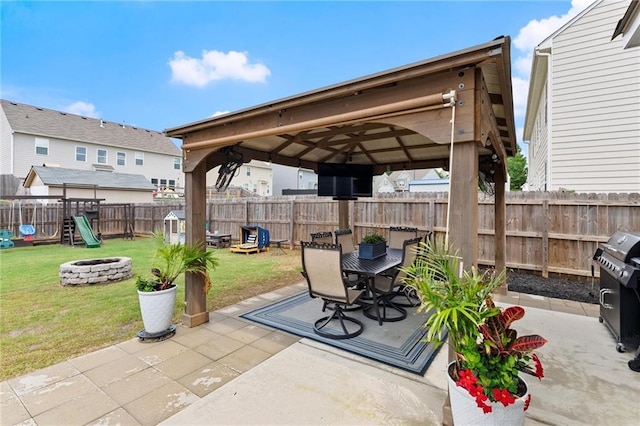 34 Hemlock Gln, Dallas, GA 30132 - view of patio / terrace with a gazebo, an outdoor fire pit, a grill, outdoor dining space, and a playground