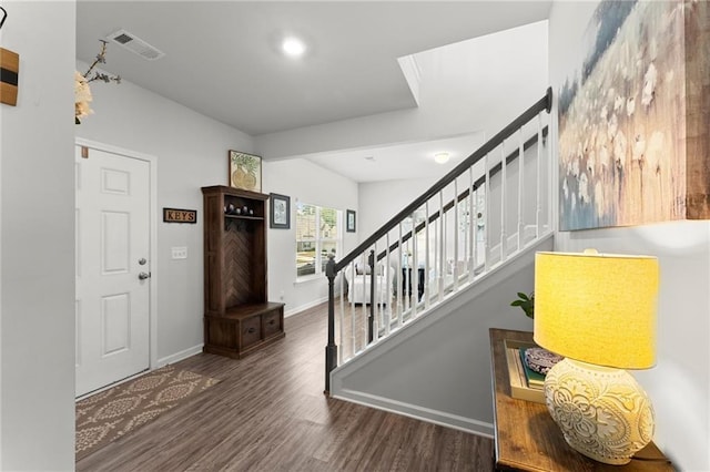 34 Hemlock Gln, Dallas, GA 30132 - entryway with wood finished floors, stairway, and baseboards