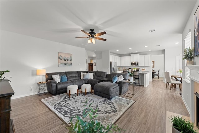 34 Hemlock Gln, Dallas, GA 30132 - living area with ceiling fan, light wood finished floors, baseboards, and recessed lighting