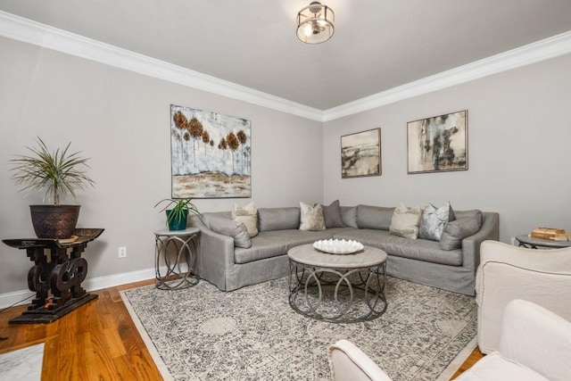 living room featuring crown molding, wood finished floors, and baseboards