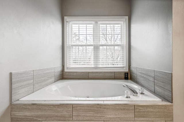 bathroom with a garden tub