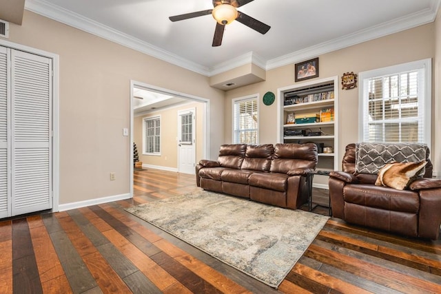 living room with ornamental molding, ceiling fan, baseboards, and dark wood-style flooring