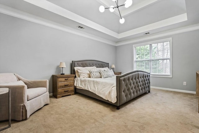 bedroom with visible vents, crown molding, baseboards, a tray ceiling, and carpet floors