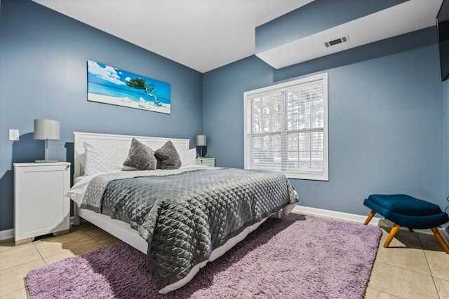 bedroom featuring tile patterned flooring, baseboards, and visible vents