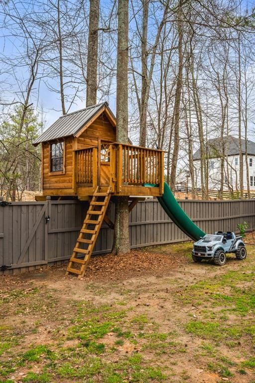 view of play area with a gate and fence