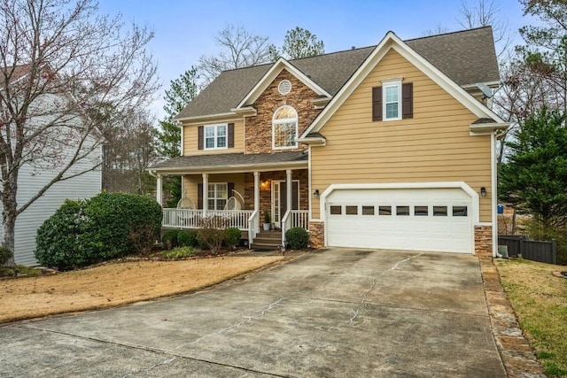 view of front facade with stone siding, covered porch, concrete driveway, a shingled roof, and a garage