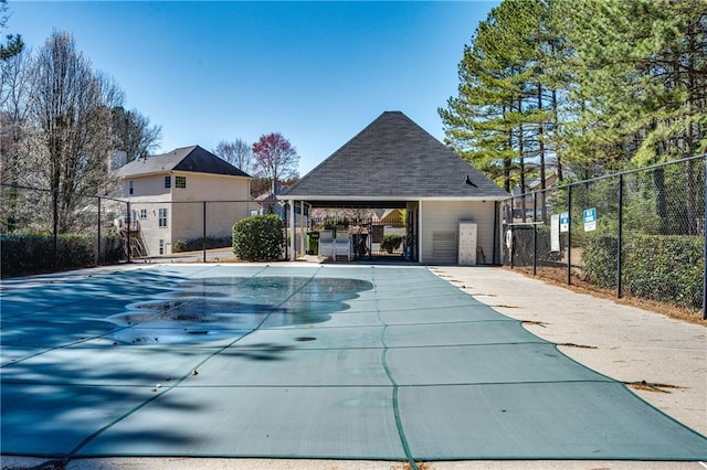 community pool featuring a gazebo and fence