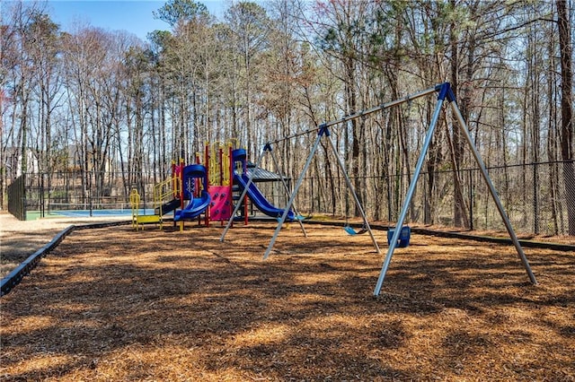 communal playground featuring fence