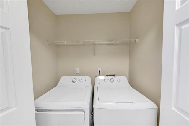 washroom featuring separate washer and dryer