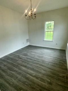 3609 Ginnis Rd, Atlanta, GA 30331 - empty room featuring a chandelier and dark wood-type flooring