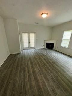 3609 Ginnis Rd, Atlanta, GA 30331 - unfurnished living room with dark wood finished floors, a fireplace, and french doors