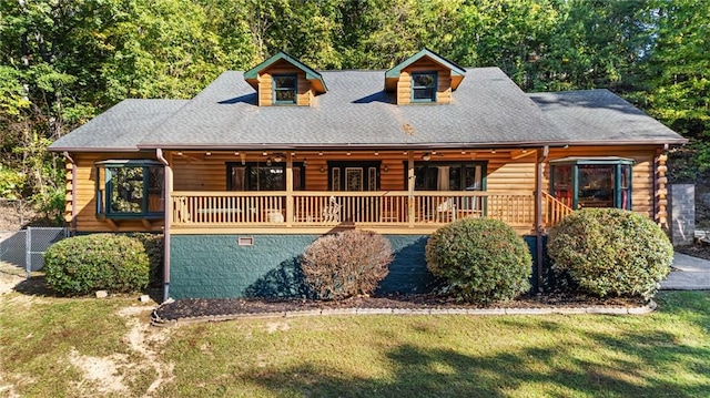 log home featuring a front yard