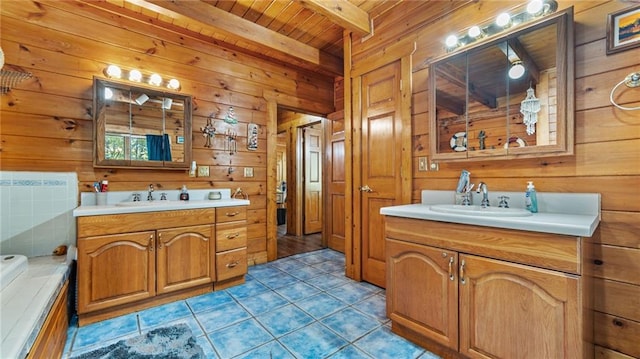 bathroom with vanity, beam ceiling, wooden ceiling, tile patterned flooring, and wood walls