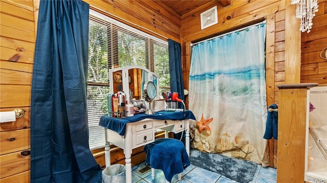 bathroom featuring tile patterned flooring, wooden ceiling, and wood walls