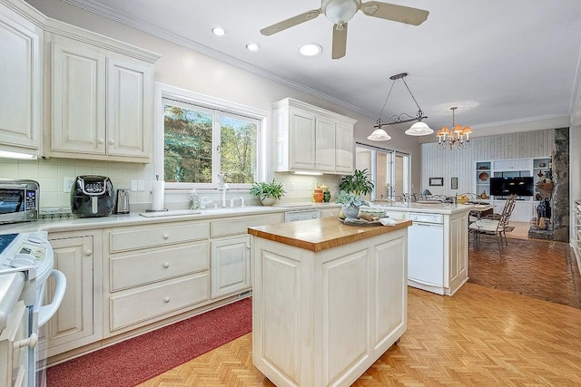 kitchen featuring tasteful backsplash, white appliances, decorative light fixtures, ceiling fan with notable chandelier, and light parquet flooring