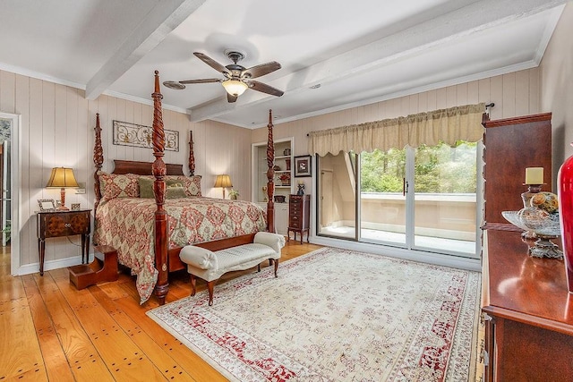 bedroom with beamed ceiling, wood-type flooring, and ceiling fan