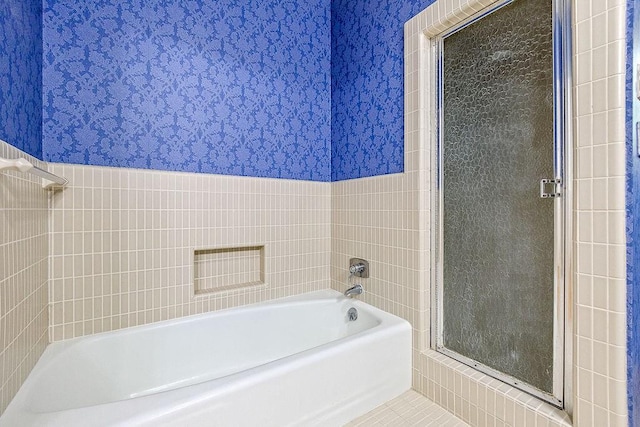 bathroom featuring tile walls and tile patterned flooring