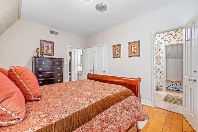 bedroom with hardwood / wood-style floors