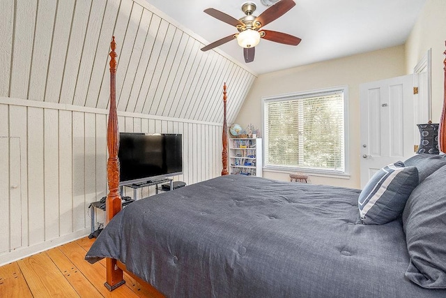 bedroom featuring lofted ceiling, hardwood / wood-style floors, and ceiling fan