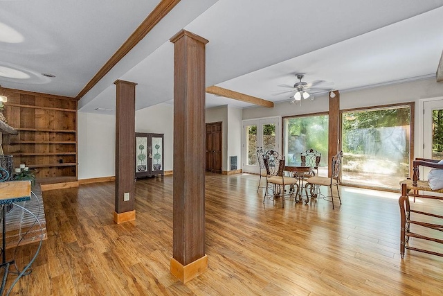 dining area with built in features, decorative columns, french doors, light hardwood / wood-style floors, and ceiling fan