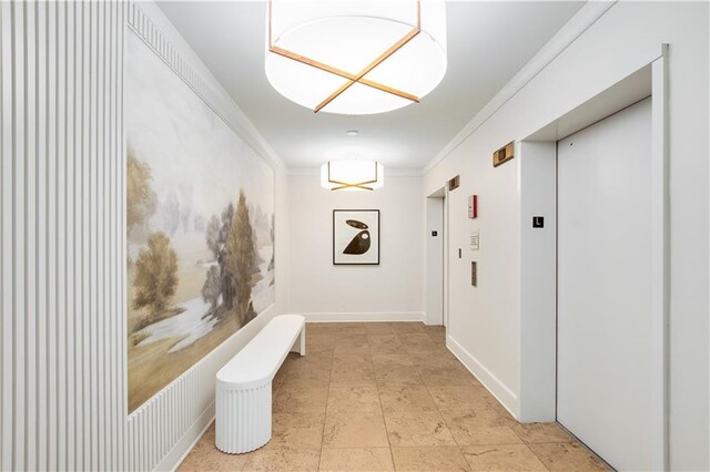 hallway featuring elevator and ornamental molding