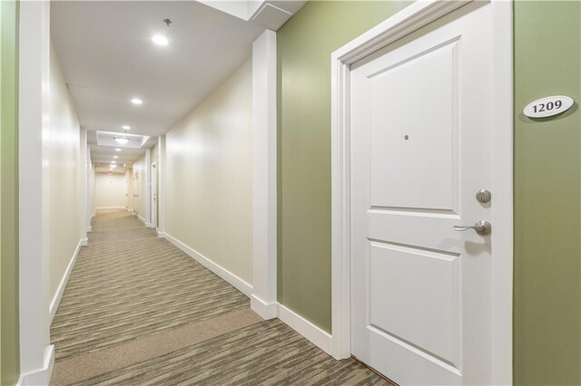 hallway featuring carpet flooring