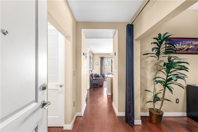 corridor featuring dark hardwood / wood-style flooring