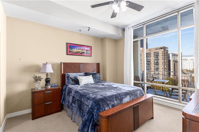 bedroom featuring ceiling fan and light colored carpet