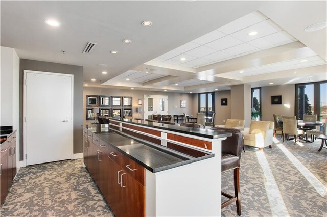 kitchen featuring a kitchen breakfast bar and a large island