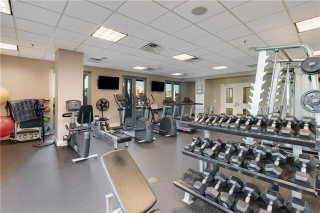 exercise room with a paneled ceiling