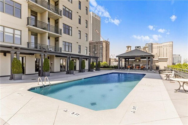 view of swimming pool with a patio area