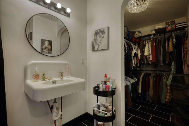 bathroom featuring a chandelier