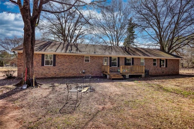 back of house with a wooden deck