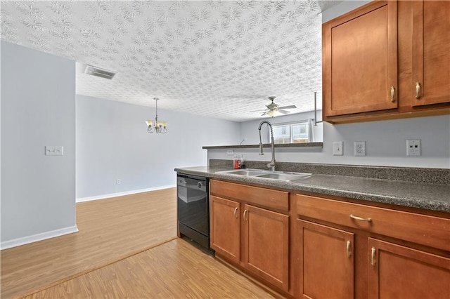 kitchen with light wood-type flooring, ceiling fan with notable chandelier, a textured ceiling, sink, and dishwasher