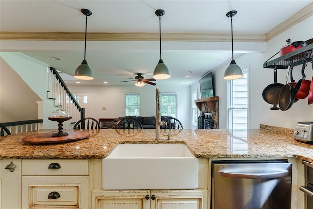 kitchen featuring ceiling fan, crown molding, light stone counters, and dishwasher