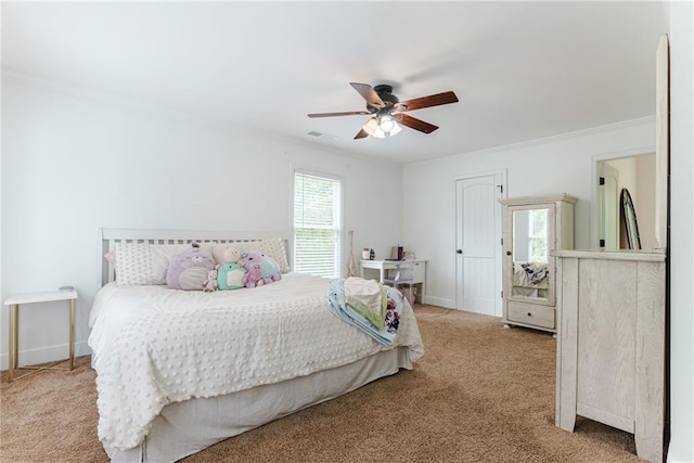 bedroom featuring ceiling fan and light carpet