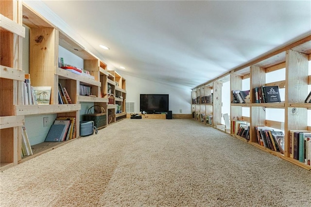 living room with vaulted ceiling and carpet flooring