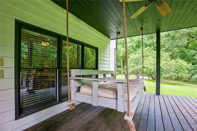 wooden terrace featuring ceiling fan