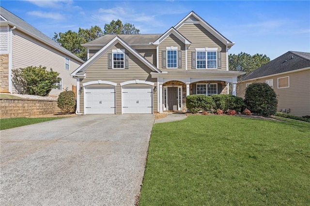 traditional-style home with a garage, covered porch, concrete driveway, and a front lawn