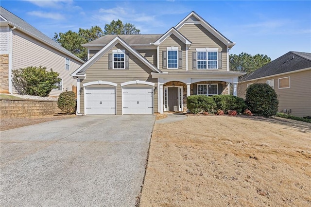 traditional-style home with driveway and an attached garage