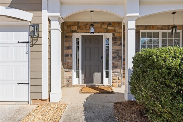 view of exterior entry featuring stone siding