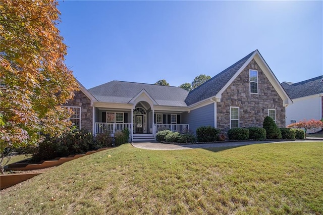 view of front of house featuring a front lawn and covered porch