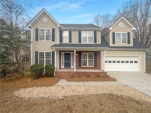 traditional-style home featuring covered porch, concrete driveway, brick siding, and an attached garage