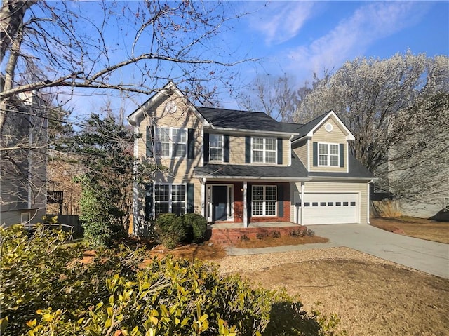 view of front of property featuring concrete driveway, brick siding, and an attached garage