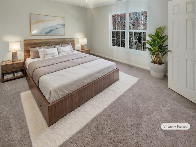 carpeted bedroom featuring baseboards