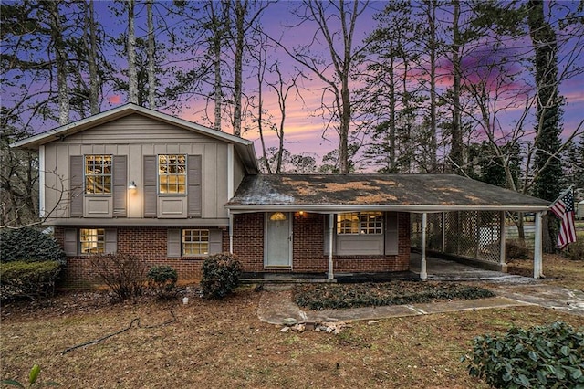 tri-level home featuring a carport